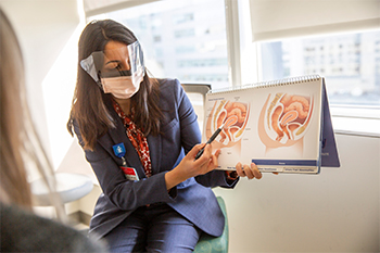 A BIDMC OB/GYN speaks with a patient. A BIDMC OB/GYN speaks with a patient.